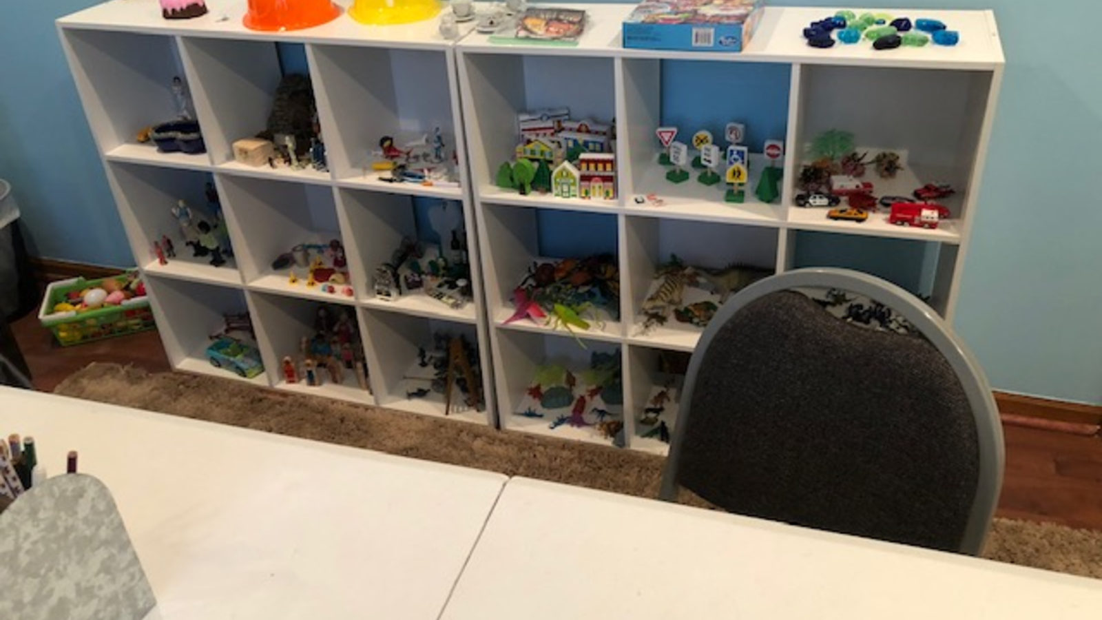 Shelves of toys and play materials in a counseling room
