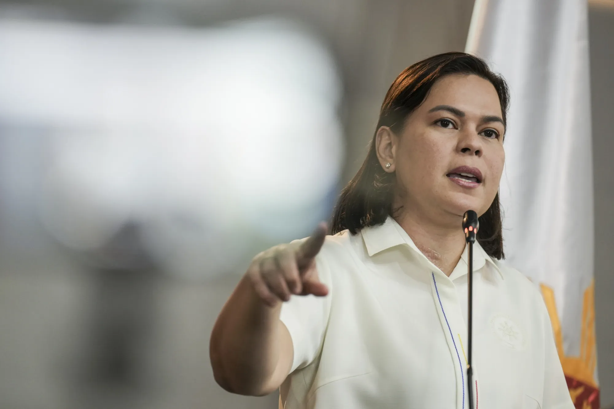 Vice President Sara Duterte gestures while speaking at a press conference