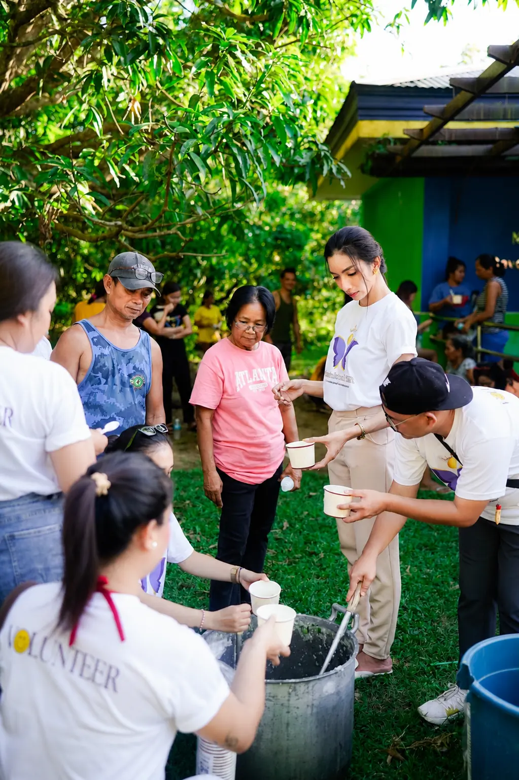 Francine Marie Bautista coordinating with volunteers during community service