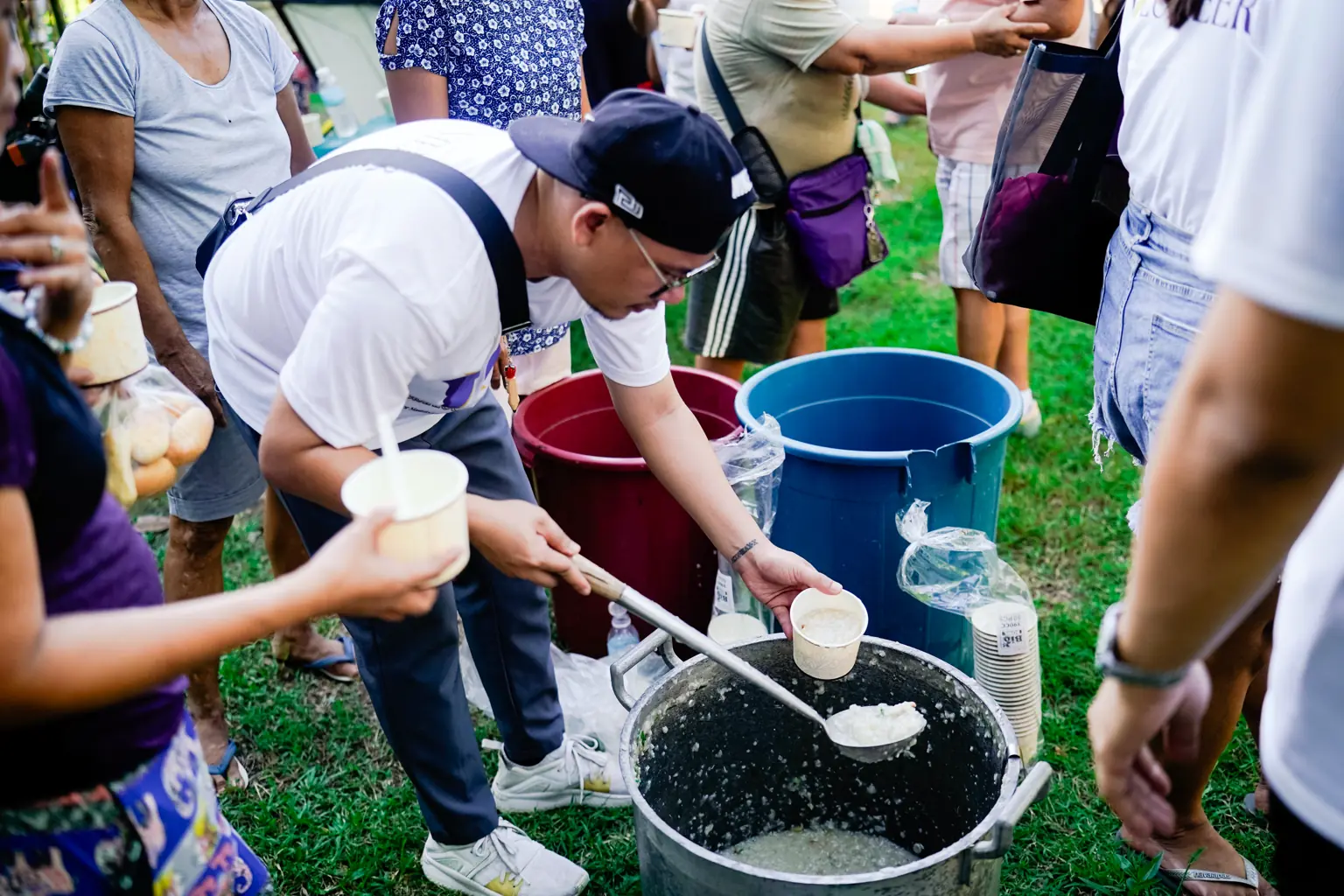 Volunteers serving food together during a community activity